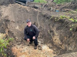 An expert Clerk of Works supervising excavation of japanese Knotweed